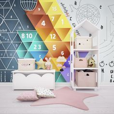 a child's room with colorful geometric wallpaper and toys on the floor in front of it