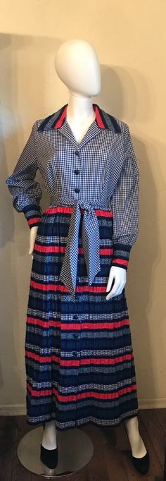 "Here is a sweetheart of a dress. It is vintage 1960's 70's in a Boho - Hippie - Country style. It is a shirtwaist style with the gingham bodice that has the contrasting print collar and has a gathered skirt in a mixed print puckered cotton blend fabrics. It also has a tie belt. Condition - good Tagged - only size / style tag remains dress. Measurements Lying Flat: Shoulder to shoulder 15\", Bust 20\", Waist 15\", Hips 24\", Length 54\", Shoulder to waist 17\"" Retro Vintage Dress With Ruffles, Retro Vintage Dress With Ruffles For Fall, Retro Vintage Midi Dress With Ruffles, Retro Vintage Dress For Fall, Retro Patchwork Dress For Fall, 1970s Lined Vintage Dress, Retro Midi Vintage Dress For Fall, 1950s Vintage Long Sleeve Dresses, 1950s Long Sleeve Vintage Dress