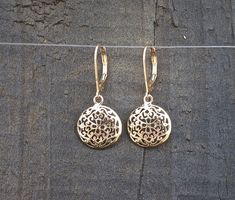 "14k Gold dangle earrings, Filigree Round mandala earrings, beautiful and delicate ethnic earrings.  Gorgeous, solid gold bohemian earrings with a dangling domed circle. The circle is designed as a delicate mandala with spiraling floral motifs. These unique, Indian style, handmade earrings are part of my ethnic jewelry collection. These lightweight and delicate 14k gold drop earrings will become your favorite go-to accessory for every occasion. Get these earrings for yourself or as a meaningful Elegant Filigree Round Pendant Jewelry, Elegant Filigree Medallion Jewelry, Elegant Rose Gold Medallion Jewelry, Fine Jewelry Dangle Earrings With Filigree, Fine Jewelry With Filigree Dangle, Elegant Gold Round Pendant Earrings, Elegant Gold Plated Circle Jewelry, Rose Gold Sterling Silver Filigree Jewelry, Elegant 14k Gold Jewelry With Intricate Design