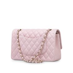 For timeless Parisian-chic there is no better investment than a Chanel classic flap bag. This Classic Flap has arrived in a truly unique colour. This pale pink Chanel is a beautifully feminine limited edition. This Chanel comes with all the iconic features, a zip pocket on the flap to hide your love notes, a front slip compartment for your reminders, and two inside slip pockets to store your phone and powder palette. The interwoven chain sits elegantly on your shoulder or doubled up on your arm. Under the creative direction of Karl Lagerfeld, Chanel continues with its line of classic quilted bags. Style with pale coloured dresses and accessorise with pearl jewellery. SPL Exterior Pale pink lambskin 'Champagne' tone hardware (in between gold and silver) Twistlock closure Signature CC Clasp Chanel Classic Flap Bag, Powder Palette, Chanel Box, Classic Flap Bag, Pink Chanel, Parisian Chic, Pink Champagne, Quilted Bag, Love Notes