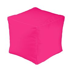 a bright pink square ottoman cover on a white background