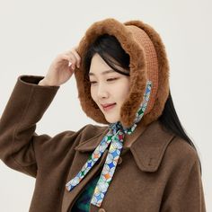 Myungssom, a modern design brand with Korean traditional beauty. Korean traditional thermal earmuffs 'Bolkki' are simple cold weather items that cover the cheeks, ears, and chin. Made of Korean-style quilted fabric with faux merino wool and faux mink trim, it can be used as earmuffs or neck warmers. It is convenient because it is made of cotton quilt and artificial fur and can be hand washed. It is 24 inches long and 4 inches wide, suitable for any adult female. You can see more product photos o Fur Neck Warmer, Beanie Styling, Earmuffs Outfit, Fur Earmuffs, Neck Warmers, Traditional Beauty, Korean Hanbok, Crochet Ear Warmer, Beanie Style