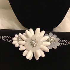 Beautiful White Flower Bracelet Has Three Flower On It With Gems Bling Bling Inside This Bracelet Would Be Great For Any Summer Outfit Adjustable White Jewelry With Flower Decoration, Adjustable White Bracelet With Flower Decoration, White Jewelry With Flower Decoration For Party, White Party Jewelry With Flower Decoration, White Flower Jewelry For Party, White Flower Decorated Jewelry For Parties, White Flower Charm Bracelet For Wedding, White Wedding Bracelets With Flower Charm, White Wedding Bracelet With Flower Charm