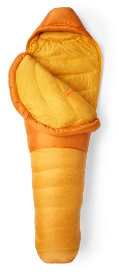 an orange sleeping bag is folded up on a white wall and it's inside