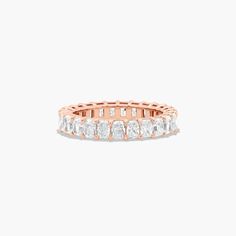 14K Rose Gold Radiant Cut Diamond Eternity Ring (3 CTW H-I / SI1-SI2). This timeless eternity ring features the boldness and intense sparkle of radiant cut diamonds. A classic, tailored shared prongs setting allows the maximum amount of the diamonds surface to show. Number of diamonds and carat total weight will vary depending on ring size. Luxury Heirloom Diamond Cut Eternity Band, Luxury Heirloom Eternity Band With Diamond Cut, Luxury Yellow Gold Eternity Band For Wedding, Luxury Heirloom Eternity Band For Engagement, Luxury Yellow Gold Half Eternity Wedding And Engagement, Luxury Yellow Gold Eternity Band For Formal Occasions, Luxury Gold Eternity Band For Formal Occasions, Luxury Heirloom Style Eternity Band As Promise Ring, Luxury Classic Yellow Gold Eternity Band