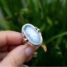 Huge Rainbow Moonstone Sterling Silver Ring, Handmade Blue Fire Gemstone Ring, Oval Moonstone Ring, June Birthstone Gift, Dainty Bridal Ring Description :- Material :- 925 Sterling Silver / 18k Gold Filled  Gemstone :- Natural Rainbow Moonstone  Stone Color :- White  Stone Shape :- Oval  Handmade Items **Made to Order** Delivery Time :- Once Item is shipped parcel will delivered to you in 2-4 weeks. C U S T O M I Z E O R D E R  All Bracelets are made with If you want to make any changes in this Moonstone Ring Sterling Silver, Moonstone Stone, June Birthstone, Ring Oval, Natural Rainbow, Blue Fire, Bridal Ring, Moonstone Ring, June Birth Stone