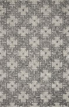 an area rug with grey and white designs on the side, in various sizes and colors