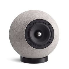 an object that is made out of concrete and has speakers on the top of it