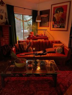 a living room filled with furniture and a fire place next to a large glass table