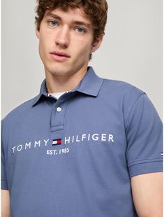 Tommy Hilfiger men's polo. What we do best. Our classic polo is made from premium cotton in a pique weave, known for its subtle, textured finish that adds dimension and breathability. Our medium-weight stretch cotton provides the ideal balance of structure and softness, with a light feel against the skin that stays comfortable all day.  Material: 97% Regenerative Cotton, 3% Elastane. Classic Blue Polo Shirt With Embroidered Logo, Fitted Cotton Polo Shirt With Branding, Tommy Hilfiger Cotton Polo Shirt With Polo Collar, Tommy Hilfiger Cotton Polo Shirt Short Sleeve, Fitted Tommy Hilfiger Polo Shirt With Short Sleeves, Classic Tommy Hilfiger Cotton Polo Shirt, Fitted Short Sleeve Tommy Hilfiger Polo Shirt, Classic Tommy Hilfiger Collared Polo Shirt, Tommy Hilfiger Cotton Polo Shirt