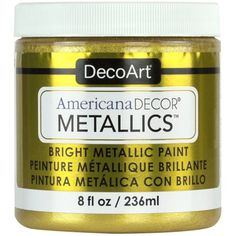 a jar of metallic paint that is gold