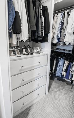 a white closet filled with lots of clothes