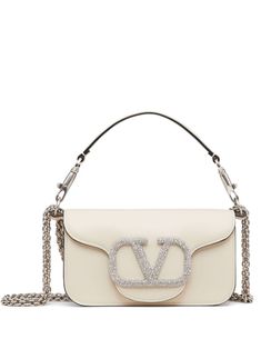 ivory white leather VLogo Signature silver-tone hardware Swarovski crystal embellishment chain-link shoulder strap single rounded top handle foldover top concealed magnetic fastening White Valentino Bag, Valentino White Bag, White Designer Bag, Girly Purse, Valentino Bag, Valentino Garavani Bag, Girly Bags, Luxury Purses, Pretty Bags