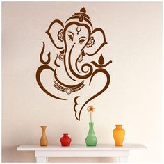 the wall decal depicts an elephant's head in brown on a white background