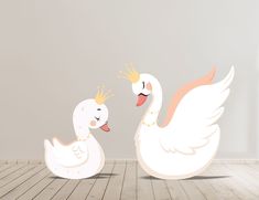 two white swans with crowns on their heads are facing each other in an empty room