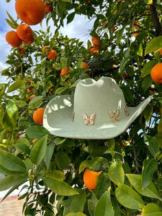 Give them butterflies in our Sage Green Butterfly Cowgirl Hat! This cute green western hat has a 3.75" brim and features gold alloy butterlfy details around the crown. Pair with your favorite denim dress and boots for a fun night out! Green Cowboy Hat, Sage Green Butterfly, Denim Dress Outfit, Dress And Boots, Western Hat, Cowgirl Hat, Green Butterfly, Belt Purse, Gold Alloys