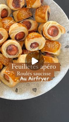 a white plate topped with pastries on top of a table