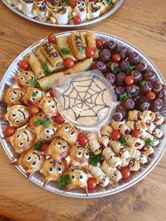 two plates filled with different types of food on top of a wooden table next to each other