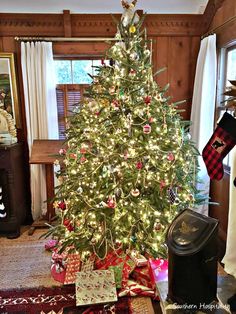 a decorated christmas tree in a living room