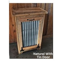 an old fashioned wooden cabinet with metal door