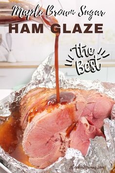 ham glaze is being poured on top of the roast in foil with text overlay that reads maple glazed ham glaze