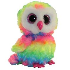 a colorful stuffed owl sitting on top of a white surface