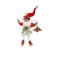 a christmas ornament hanging from the ceiling with an elf on it's back