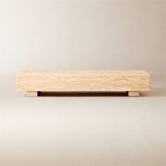 a wooden shelf sitting on top of a white floor