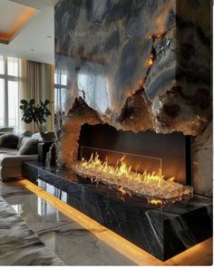 a modern fireplace in the middle of a living room with marble walls and flooring