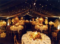 an image of a wedding reception in a marquee with white tablecloths