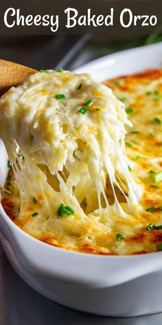 a spoon full of cheesy baked orzo