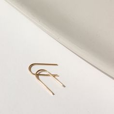 Simple and effortless, yet anything but basic, our 14k gold Arches minimal design means endless wear for everyday style. A great earring for sensitive ears and a must-have addition to your fine jewelry collection. DETAILS14k Solid GoldApprox. 0.5" dropHypoallergenic, Nickel Free and Water Safe Simple Design 14k Gold Earrings, Tiny 14k Gold Hoop Earrings For Everyday, Classic Everyday Hoop Earrings In Recycled Gold, Minimalist 14k Gold Jewelry For Everyday, Minimalist Yellow Gold Hoop Earrings, Minimalist Yellow Gold Jewelry For Everyday Elegance, Elegant 14k Gold Everyday Hoop Earrings, Elegant 14k Gold Hoop Earrings For Everyday, Elegant 14k Gold Everyday Earrings