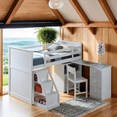 a white loft bed with desk underneath it