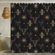 a black shower curtain with gold stars and longhorns on it in a bathroom