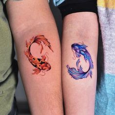 two colorful koi fish tattoos on both legs