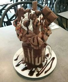 there is a chocolate cake with ice cream and sprinkles on the top