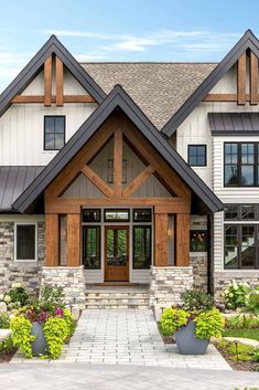 a large house with stone and wood accents