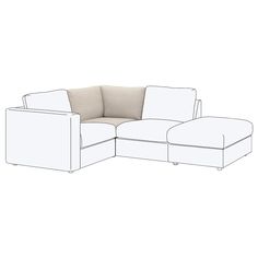 a white couch sitting next to a ottoman