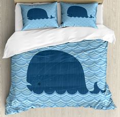 an elephant bedding set with blue waves