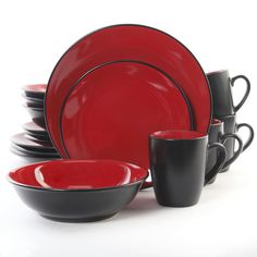 red and black dishes are stacked on top of each other, with cups in the middle