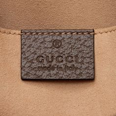 Gucci continues to reinterpret its rich heritage under current Creative Director Alessandro Michele (2015). Maintaining a balance between historical reference and contemporary eclectic flare, the brand’s signature “double g” remains iconic. Gucci has been recognized as a worldwide leader in the luxury goods market for 90 years. Designer Leather Pouch For Gifts, Designer Rectangular Bag With Engraved Logo, Luxury Top Handle Pouch, Luxury Gift Tote Pouch, Classic Brown Bag With Engraved Logo, Classic Brown Bags With Engraved Logo, Brown Leather Bags With Engraved Logo, Designer Shoulder Bag With Engraved Logo For Everyday, Designer Brown Shoulder Bag Pouch