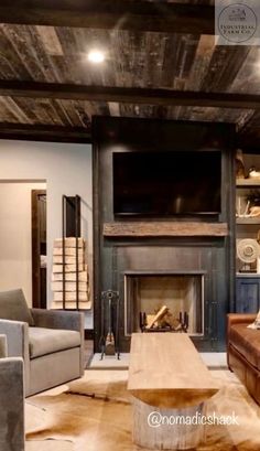 a living room filled with furniture and a flat screen tv mounted on the wall above a fire place