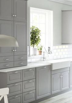 the website for stylish storage is displayed in an image with white and gray cabinets