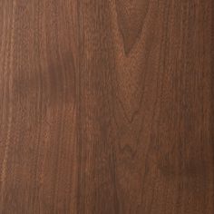 a close up view of the wood grains on this wooden surface, which is very dark brown