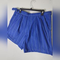 Vintage Newport Blue Striped Shorts. Tag Size 36, Bigger Fit. Built In Belt With Button And Zipper Closure. Pockets On Front And Back. Brand Patch On Back. No Holes Or Stains. Attention: Vintage/Thrifted Items Can Have Loose Threads, Faded Colors, Discoloration, Pilling, And/Or Mild Odors. Major Defects Will Be Listed. Some Specialty Fabrics, Nwt Items, Or Bulkier Items May Not Be Washed. Ask All Questions Related To Color, Size, Or Condition Prior To Purchase. All Sales Final. Blue Striped Shorts, Newport Blue, Thrifted Items, Faded Colors, City Shorts, Seersucker Pants, White Halter Maxi Dress, Blue Jean Shorts, Fade Color