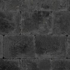 a black brick wall that is made out of concrete blocks and has no mortars on it