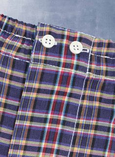 The styling of our woven Perfect Boxer in Multi Purple Plaid has been meticulously honed to provide the perfect rise and fit. The fit does away with all excess, baggy fabric and is as comfortable when worn under a pair of slim 5-pocket jeans as under dress pants. Our boxer features bespoke details found only in exclusive custom-made boxers. There are two operable buttons at the waist, as well as a functional fly opening. The waistband elastic is fully covered with pleated fabric running the leng Classic Plaid Cotton Bottoms, Classic Plaid Bottoms With Pockets, Shirting Fabric, Purple Plaid, Promotional Events, Pleated Fabric, Under Dress, Boxer Shorts, Pocket Jeans