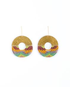 Bohemian Circle Beaded Earrings With Dangling Beads, Artisan Multicolor Beaded Earrings With Gold Beads, Multicolor Brass Earrings For Festivals, Multicolor Fringe Beaded Earrings With Round Beads, Brass Beaded Earrings With Round Beads For Festival, Festival Brass Earrings With Colorful Beads, Multicolor Brass Beaded Earrings For Festival, Gold Fair Trade Beaded Jewelry, Artisan Handwoven Round Beaded Earrings