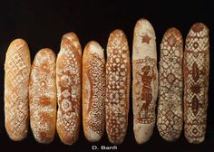 several different types of breads lined up in a row