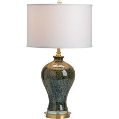 a table lamp with a white shade on it